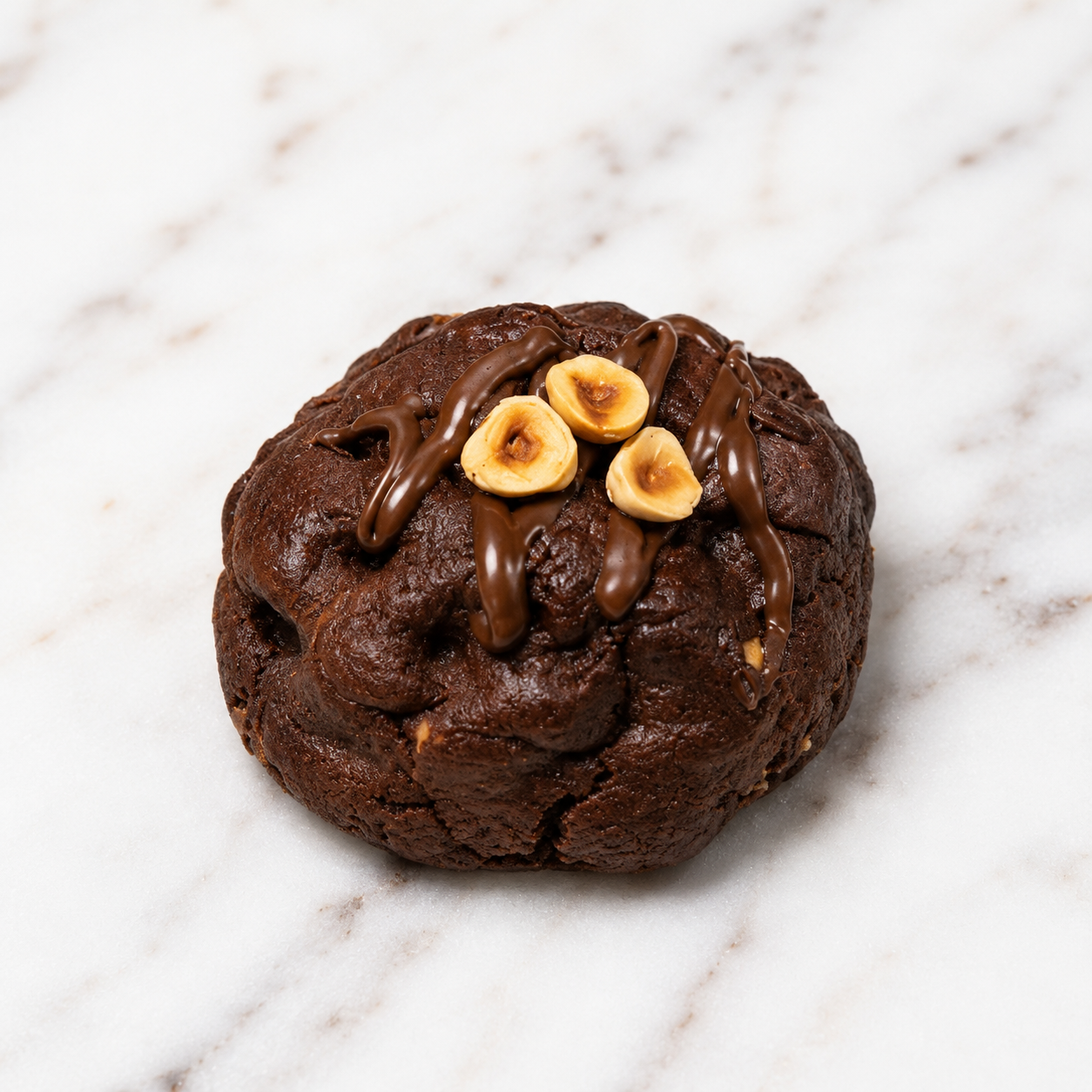 Chocorrero Bomb, a rich chocolate cookie with hazelnuts and a gooey center
