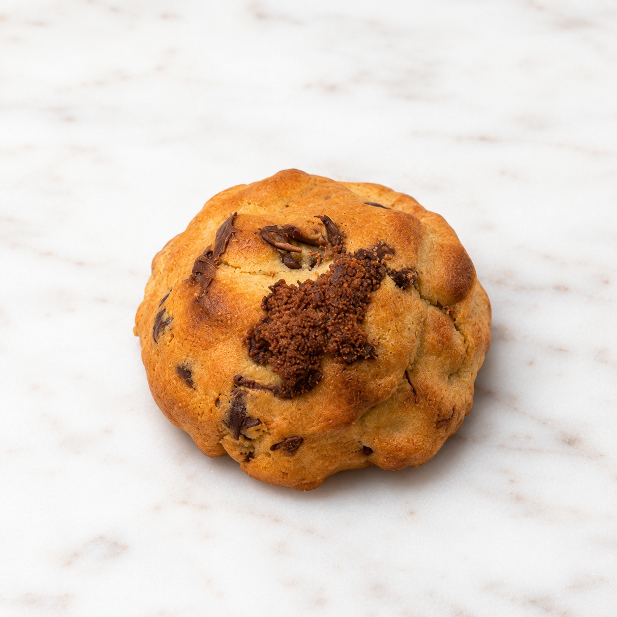 La OG Brookie, a thick golden chocolate chip cookie with a brownie center